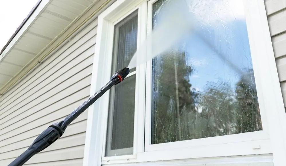 The exterior windows being pressure cleaned with pressure washer in Melton, VIC.
